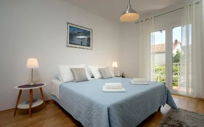 Krevet ili kreveti u jedinici u objektu Apartments Bogdanić