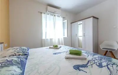 Krevet ili kreveti u jedinici u objektu Apartment Podstrana With Sea View 10