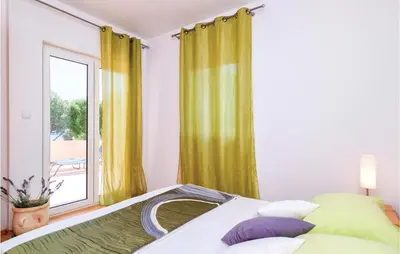Krevet ili kreveti u jedinici u objektu Holiday Home Zastrazisce With Sea View 04