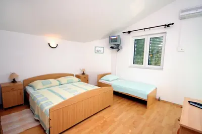 Krevet ili kreveti u jedinici u objektu Apartments by the sea Balica Rat, Omis - 4868