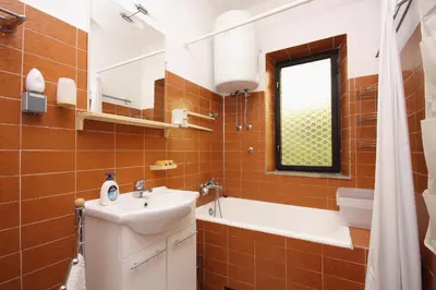 Kupaonica u objektu Apartments by the sea Sumartin, Brac - 5619