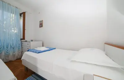Krevet ili kreveti u jedinici u objektu Apartments by the sea Postira, Brac - 6053
