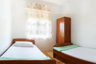 Krevet ili kreveti u jedinici u objektu Apartments by the sea Mimice, Omis - 656
