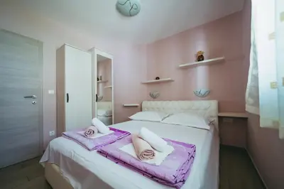 Krevet ili kreveti u jedinici u objektu Family-friendly apartments with swimming pool Promajna, Makarska - 6849