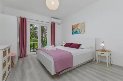 Krevet ili kreveti u jedinici u objektu Apartments by the sea Brela, Makarska - 2713
