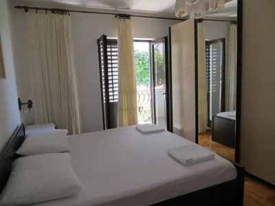 Krevet ili kreveti u jedinici u objektu Apartments and Rooms Rogosic