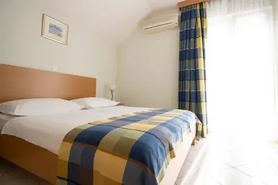Krevet ili kreveti u jedinici u objektu Apartments Ivana