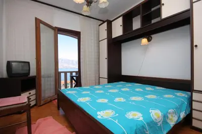 Krevet ili kreveti u jedinici u objektu Apartments by the sea Postira, Brac - 740