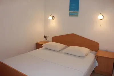 Krevet ili kreveti u jedinici u objektu Apartments by the sea Mimice, Omis - 2774