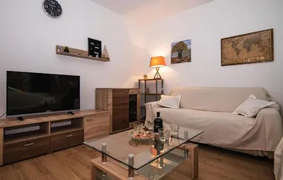 TV i/ili zabavni centar u objektu Holiday Home Postira With Fireplace Vii