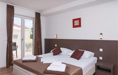 Krevet ili kreveti u jedinici u objektu Holiday Home Postira With Sea View X