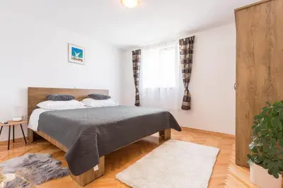Krevet ili kreveti u jedinici u objektu Apartments Lidija - sea view apartment with exclusive right of using hot tub or split level apartment with exclusive right of using pool