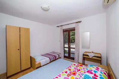 Krevet ili kreveti u jedinici u objektu Apartments and Rooms Drpić
