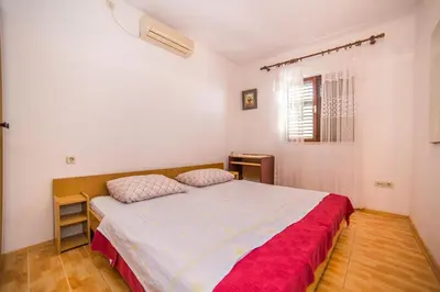 Krevet ili kreveti u jedinici u objektu Apartments and Rooms Drpić