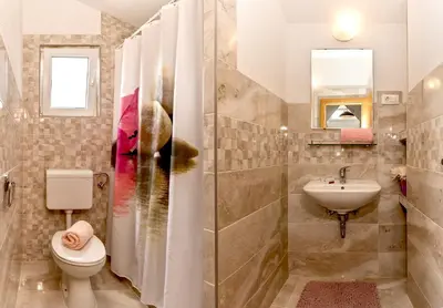 Kupaonica u objektu Beach Resort Apartments Bucina
