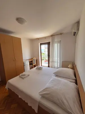 Krevet ili kreveti u jedinici u objektu Apartments and Rooms Mamić