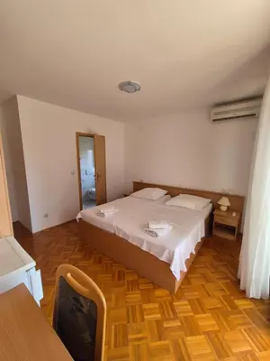 Krevet ili kreveti u jedinici u objektu Apartments and Rooms Mamić
