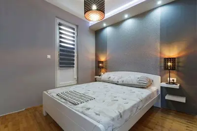 Krevet ili kreveti u jedinici u objektu Apartments Romantica