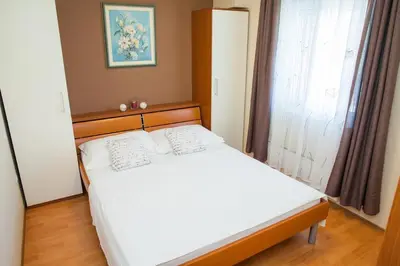 Krevet ili kreveti u jedinici u objektu Apartmani Petričević