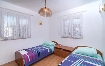 Krevet ili kreveti u jedinici u objektu Two-Bedroom Apartment In Supetar