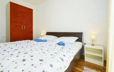 Krevet ili kreveti u jedinici u objektu Three-Bedroom Apartment In Mali Rat