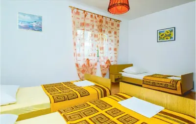 Krevet ili kreveti u jedinici u objektu Four-Bedroom Apartment In Omis