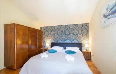 Krevet ili kreveti u jedinici u objektu Three-Bedroom Apartment In Ostrvica
