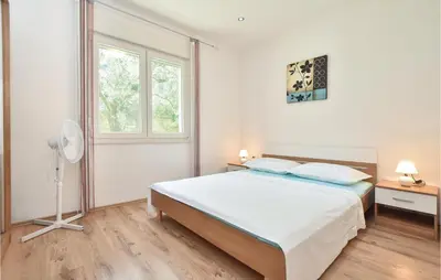 Krevet ili kreveti u jedinici u objektu Four-Bedroom Apartment In Srinjine