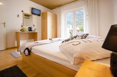 Krevet ili kreveti u jedinici u objektu Apartment & Rooms Marigold