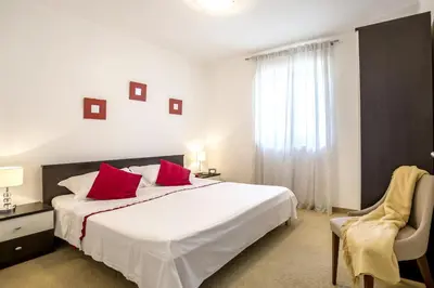 Krevet ili kreveti u jedinici u objektu Family-friendly apartments with swimming pool Podstrana, Split - 7539