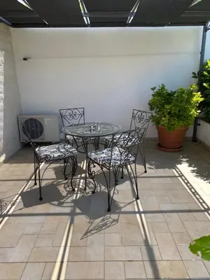 Popločani dio dvorišta ili vanjski dio objekta Apartments Lena