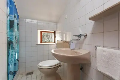 Kupaonica u objektu Apartments by the sea Sumartin, Brac - 12036
