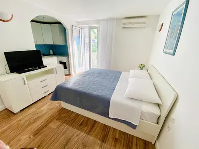 TV i/ili zabavni centar u objektu Apartments by the sea Postira, Brac - 2928