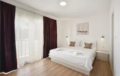 Krevet ili kreveti u jedinici u objektu Ten-Bedroom Holiday Home In Duce