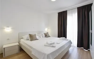 Krevet ili kreveti u jedinici u objektu Ten-Bedroom Holiday Home In Duce