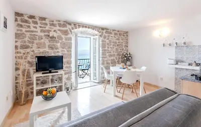 TV i/ili zabavni centar u objektu Seaside Apartments Bol