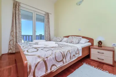 Krevet ili kreveti u jedinici u objektu Apartments Bogdan