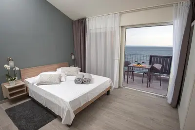 Krevet ili kreveti u jedinici u objektu Seaside Luxury Suites