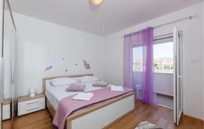 Krevet ili kreveti u jedinici u objektu Four-Bedroom Holiday Home In Stobrec