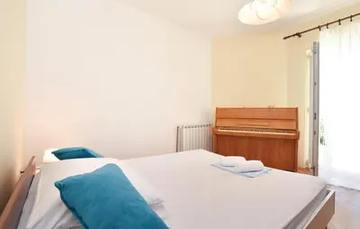Krevet ili kreveti u jedinici u objektu Family friendly apartments with a swimming pool Podstrana, Split - 13828