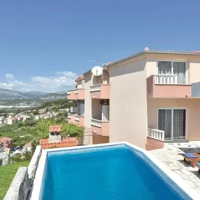 Family friendly apartments with a swimming pool Podstrana