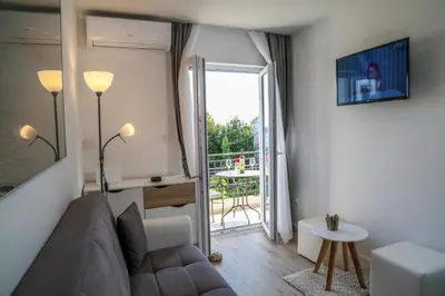 TV i/ili zabavni centar u objektu Apartments Sunset