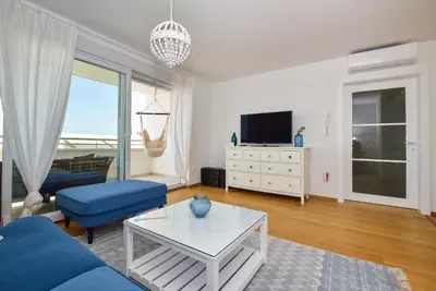 TV i/ili zabavni centar u objektu Apartment Ricca Seaview