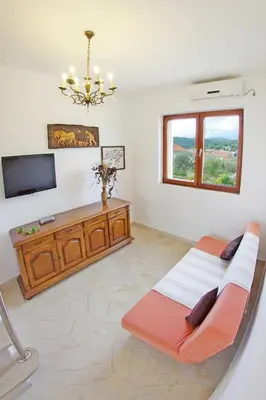 TV i/ili zabavni centar u objektu Holiday house with a swimming pool Sumartin, Brac - 12482