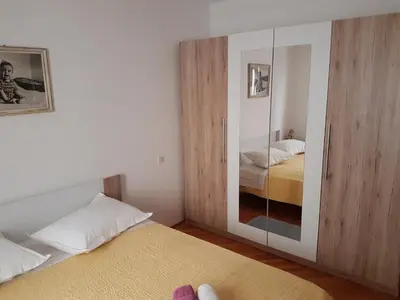 Krevet ili kreveti u jedinici u objektu Apartments with a parking space Omis - 13785