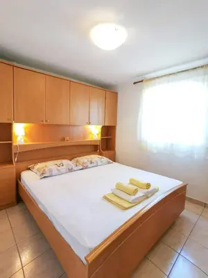 Krevet ili kreveti u jedinici u objektu Apartments by the sea Mimice, Omis - 14230