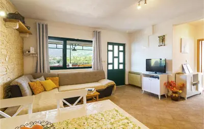 TV i/ili zabavni centar u objektu Two-Bedroom Holiday Home In Zastrazisce