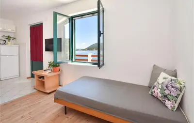 Krevet ili kreveti u jedinici u objektu Two-Bedroom Holiday Home In Zastrazisce