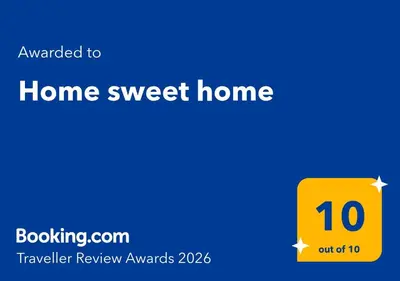 Certifikat, nagrada, logo ili neki drugi dokument izložen u objektu Home sweet home