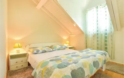 Krevet ili kreveti u jedinici u objektu Three-Bedroom Holiday Home In Slime